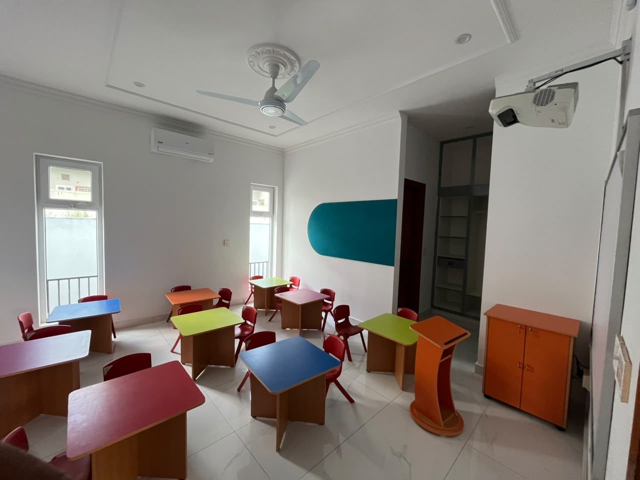 Colourful pre-primary classroom with projector at B-17 Campus