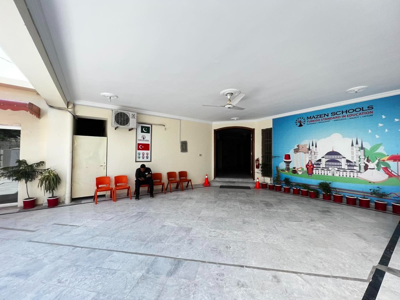 Covered reception forecourt with Turkish heritage mural at Soan Garden Campus