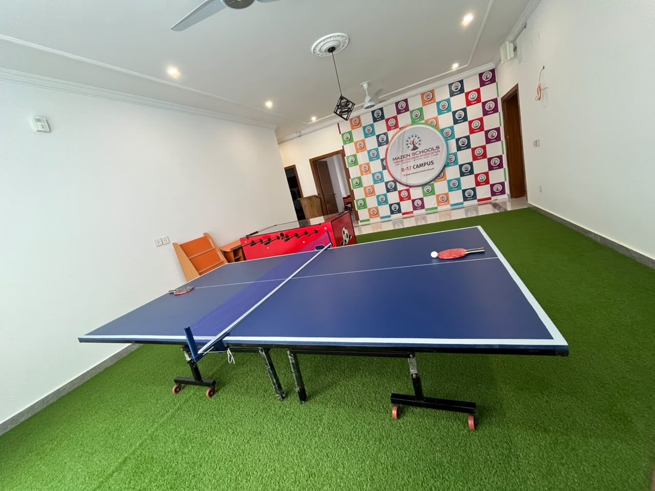 Indoor games room with table tennis and foosball at B-17 Campus
