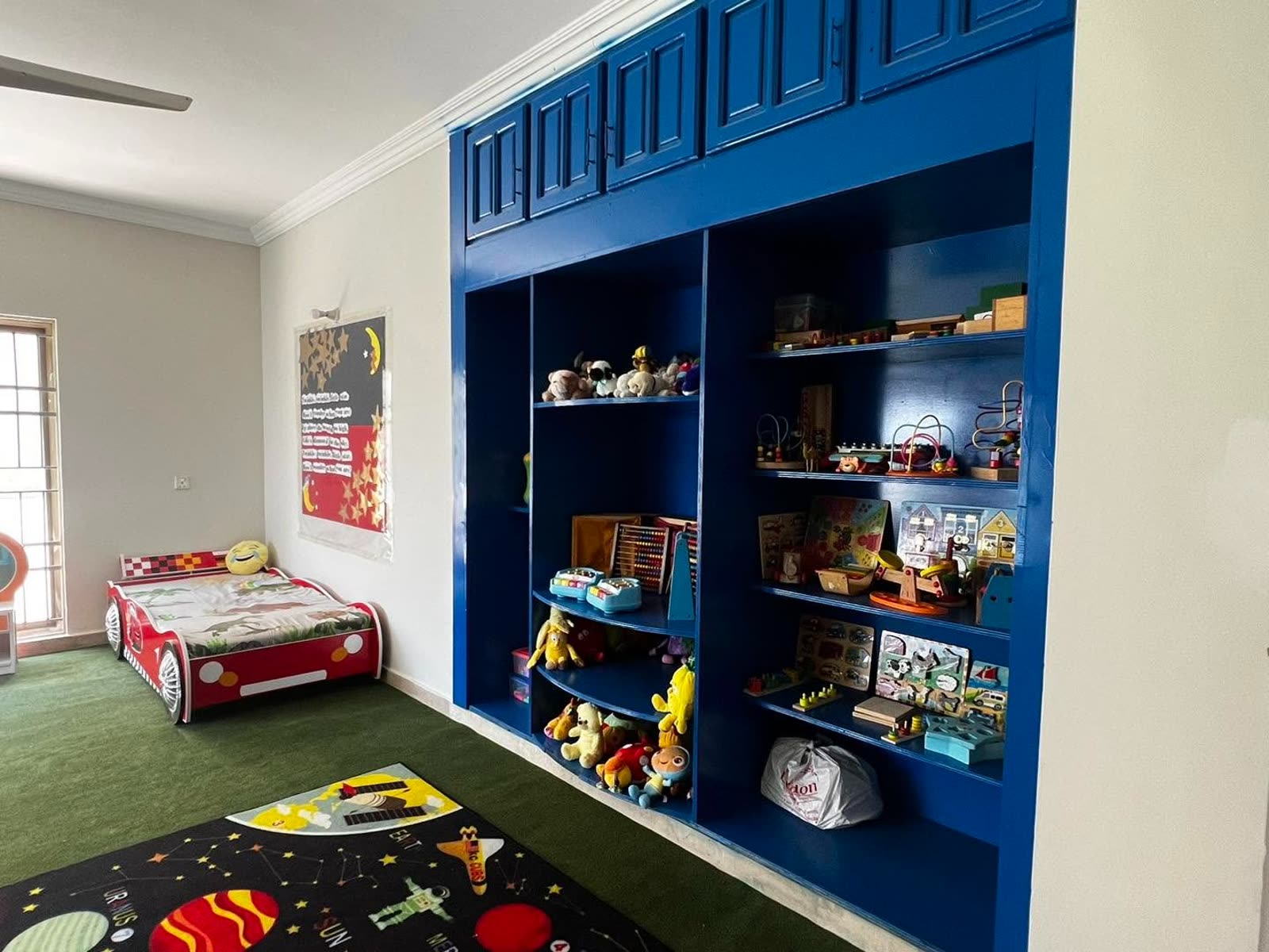 Montessori materials shelving and reading nook at Soan Garden Campus